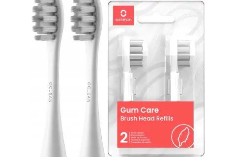 Dwa białe, zapakowane końcówki do szczoteczki Oclean Gum Care. Różne rodzaje końcówek Oclean zapewniają delikatną pielęgnację dziąseł.